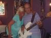 Diane gets a squeeze from Eddie who is playing bass during Wed. Open Mic at Bourbon St.